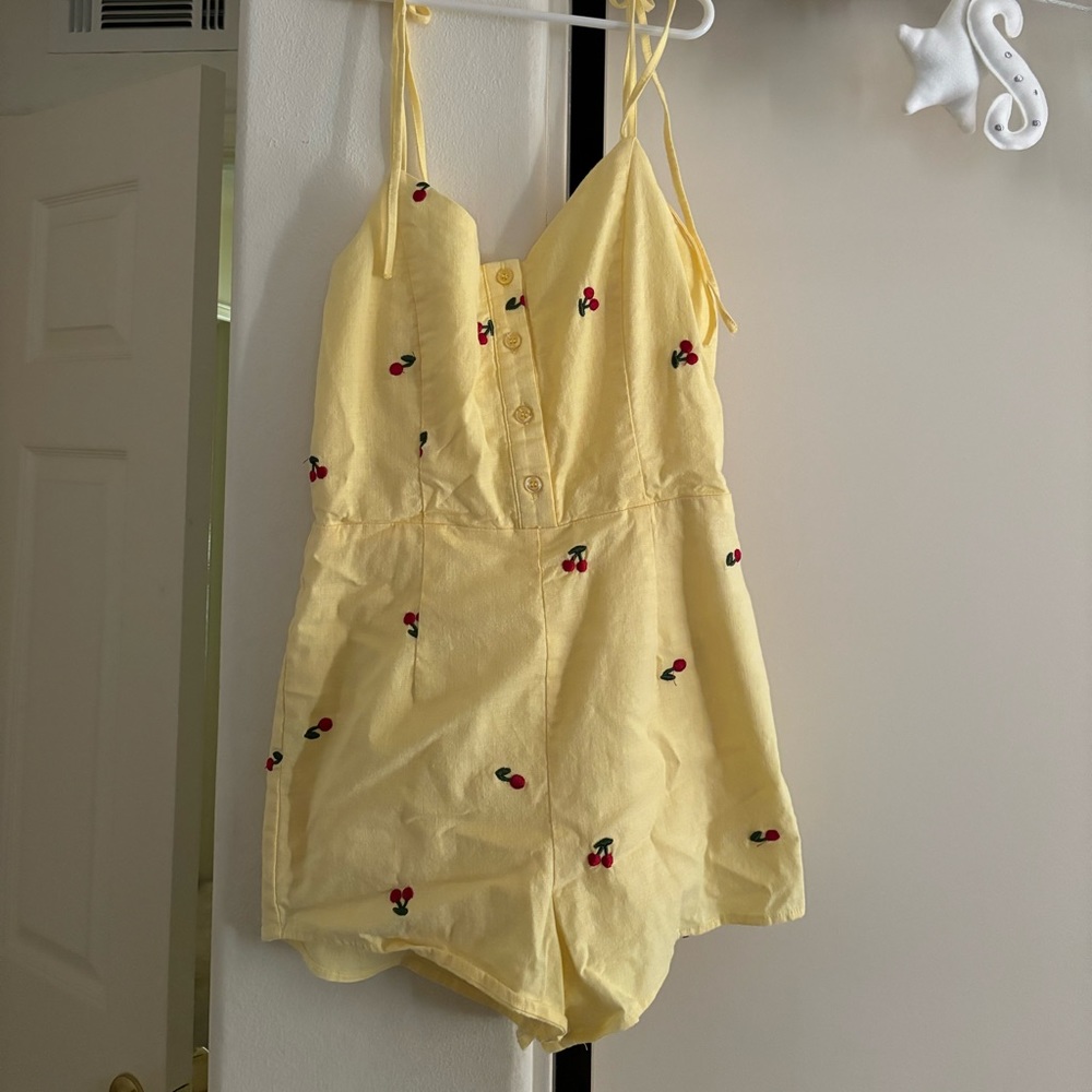 Yellow romper with cherries